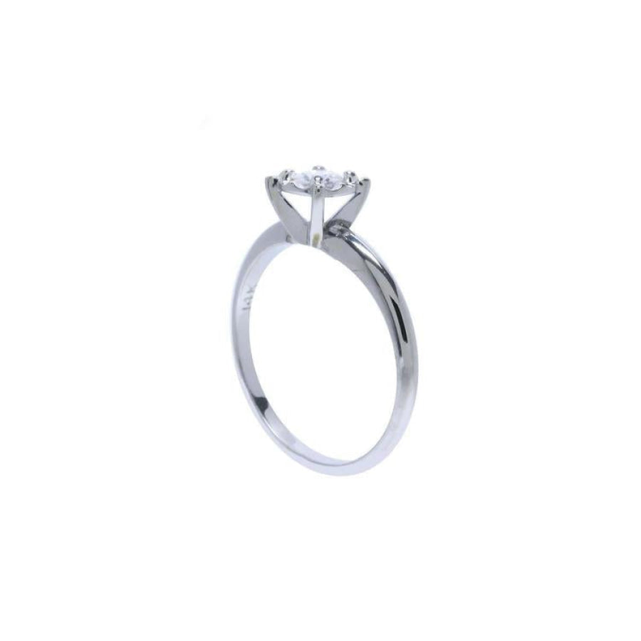 Round cut diamond solitaire engagement ring in 14K white gold with an illusion setting.