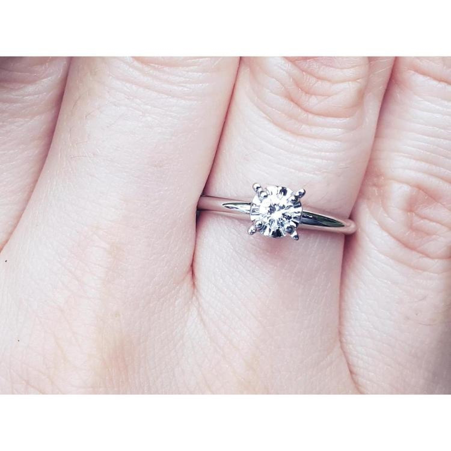 Natural diamond solitaire engagement ring 14k white gold.