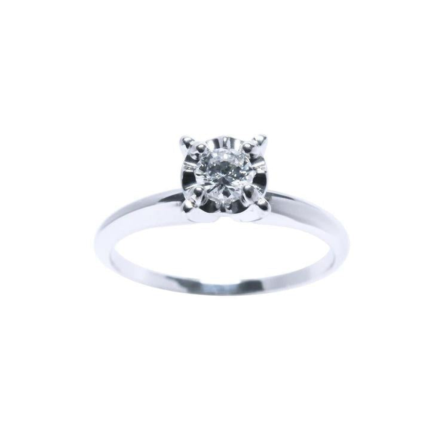 Inexpensive Diamond solitaire engagement ring in 14k whit gold.