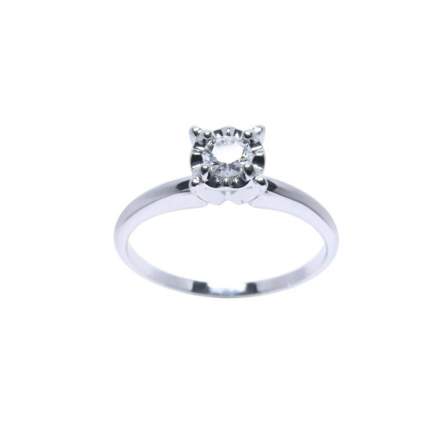 Round cut diamond solitaire engagement ring in 14K white gold with illusion setting.
