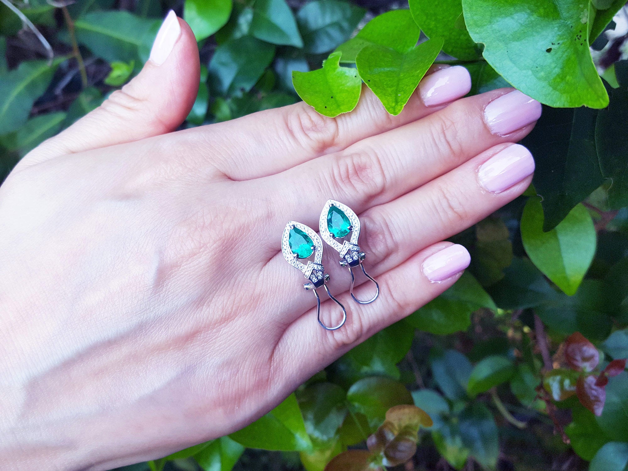 Emerald halo stud earrings