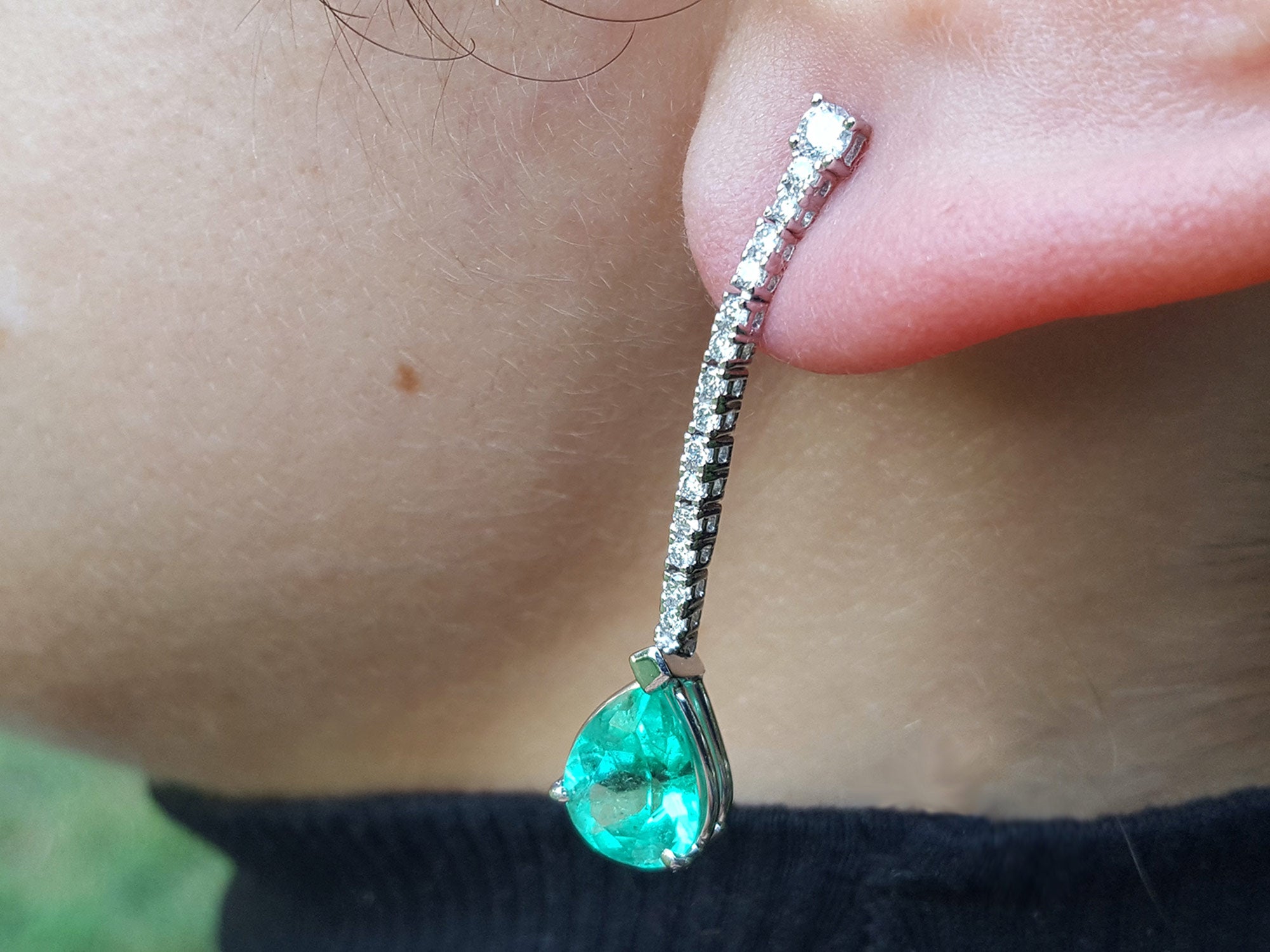 Emerald and diamond dangle earrings