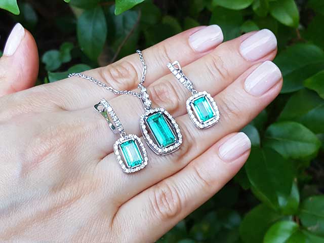 Emerald solitaire earrings for women