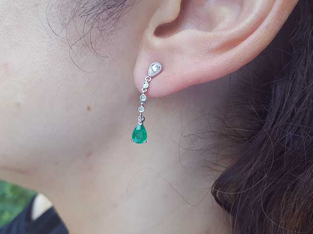 Pear cut emerald stud earrings