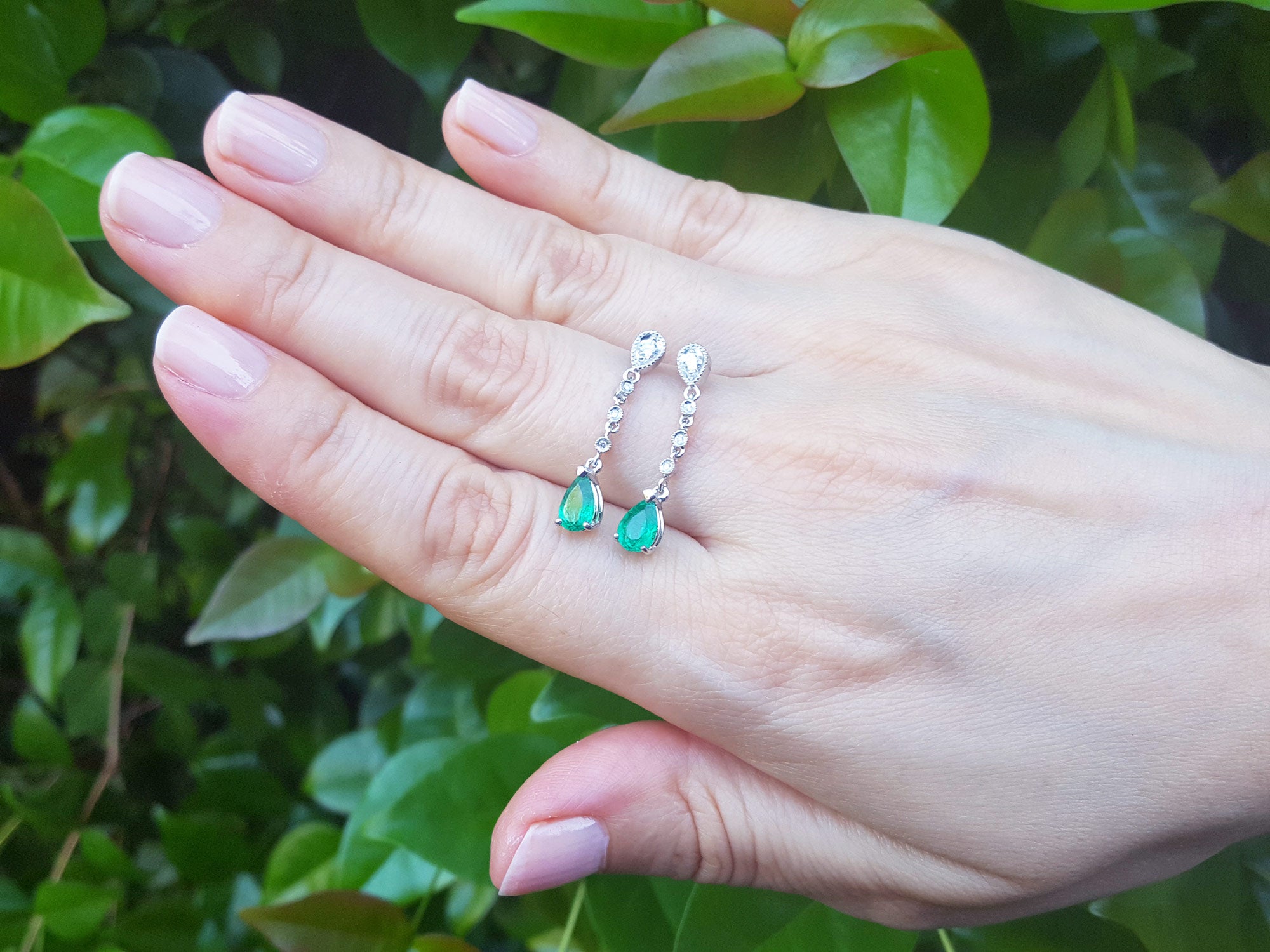 Emerald and diamond dangling earrings