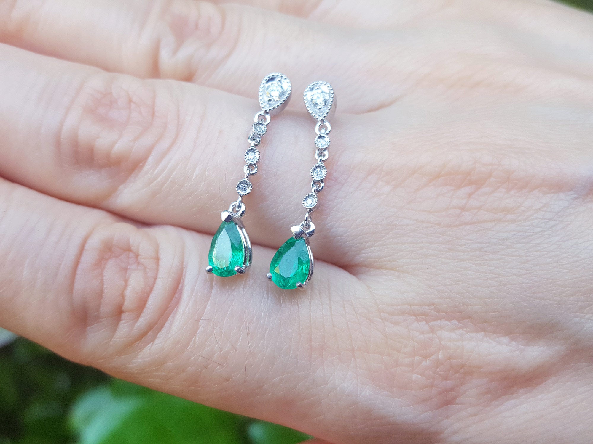 Push backs pear shaped emerald earrings