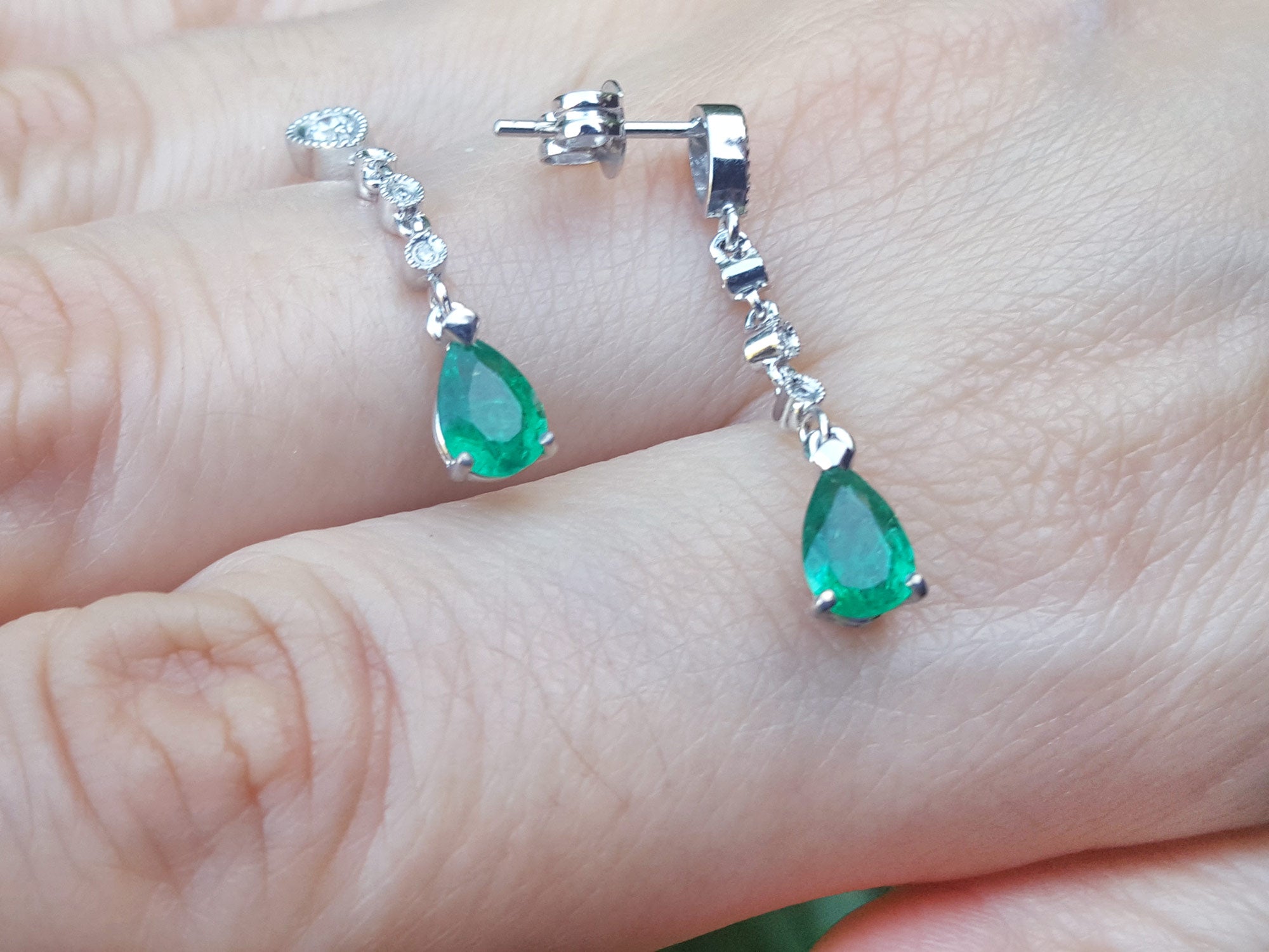 White gold emerald earrings pear shaped