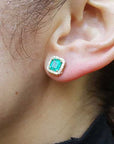 Halo emerald-cut emerald stud earrings