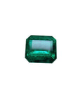 Vivid green emerald cut Colombian emerald gemstone.
