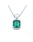 GIA certified Colombian emerald pendant with diamond halo in 18K white gold.