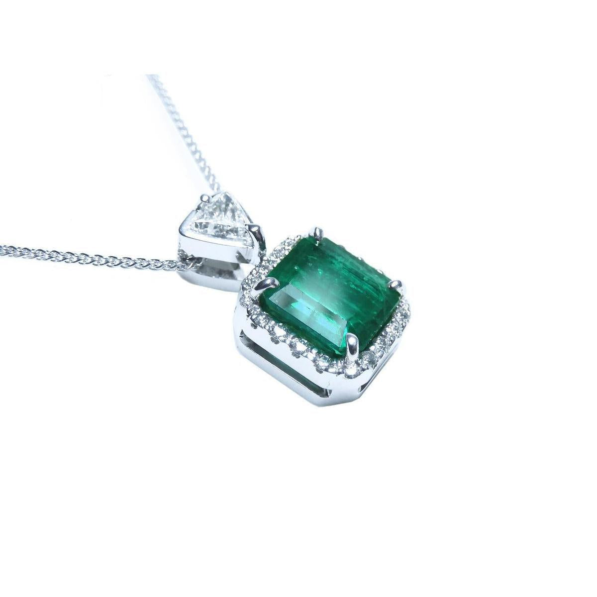 A GIA certified F1 colombian emerald pendant, crafted in 18k white gold.