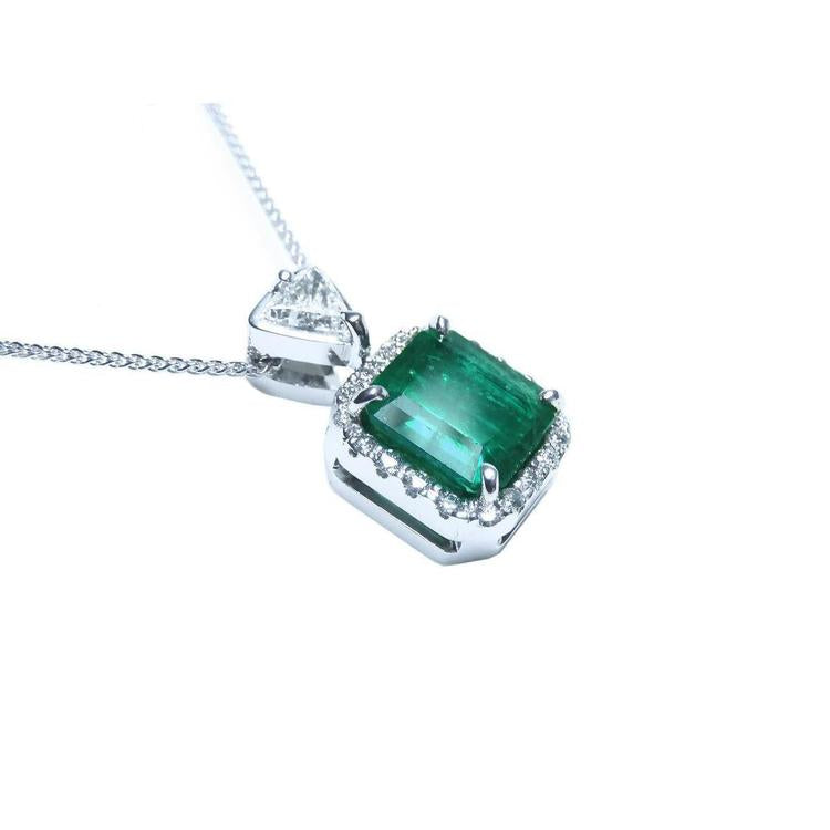 A GIA certified F1 colombian emerald pendant, crafted in 18k white gold.