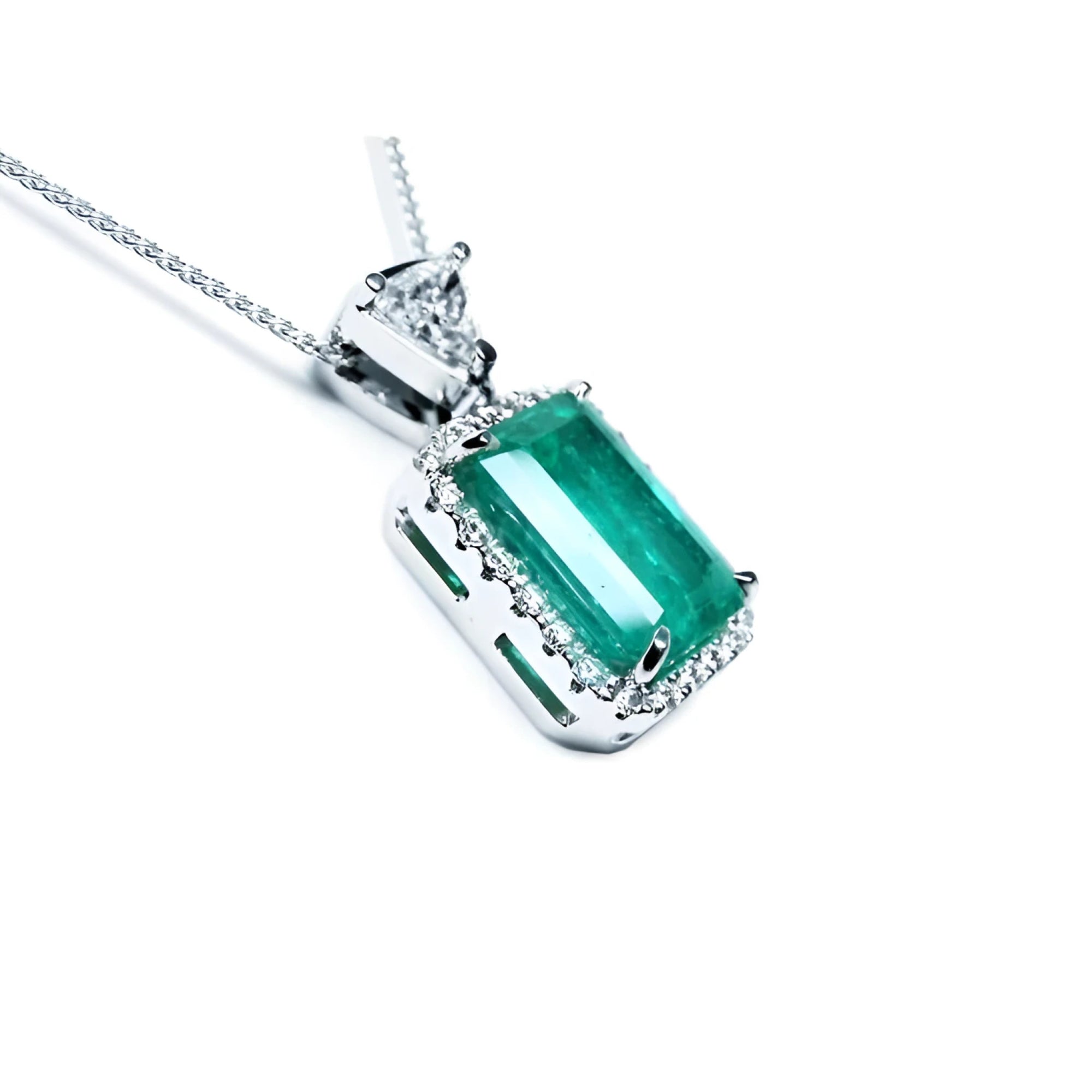 GIA certified 5.65 ct Colombian emerald pendant with medium-deep green emerald-cut gem and diamond halo in 18K white gold.