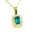 GIA certified F1 natural colombian emerald pendant halo diamond made of 18k yellow gold.