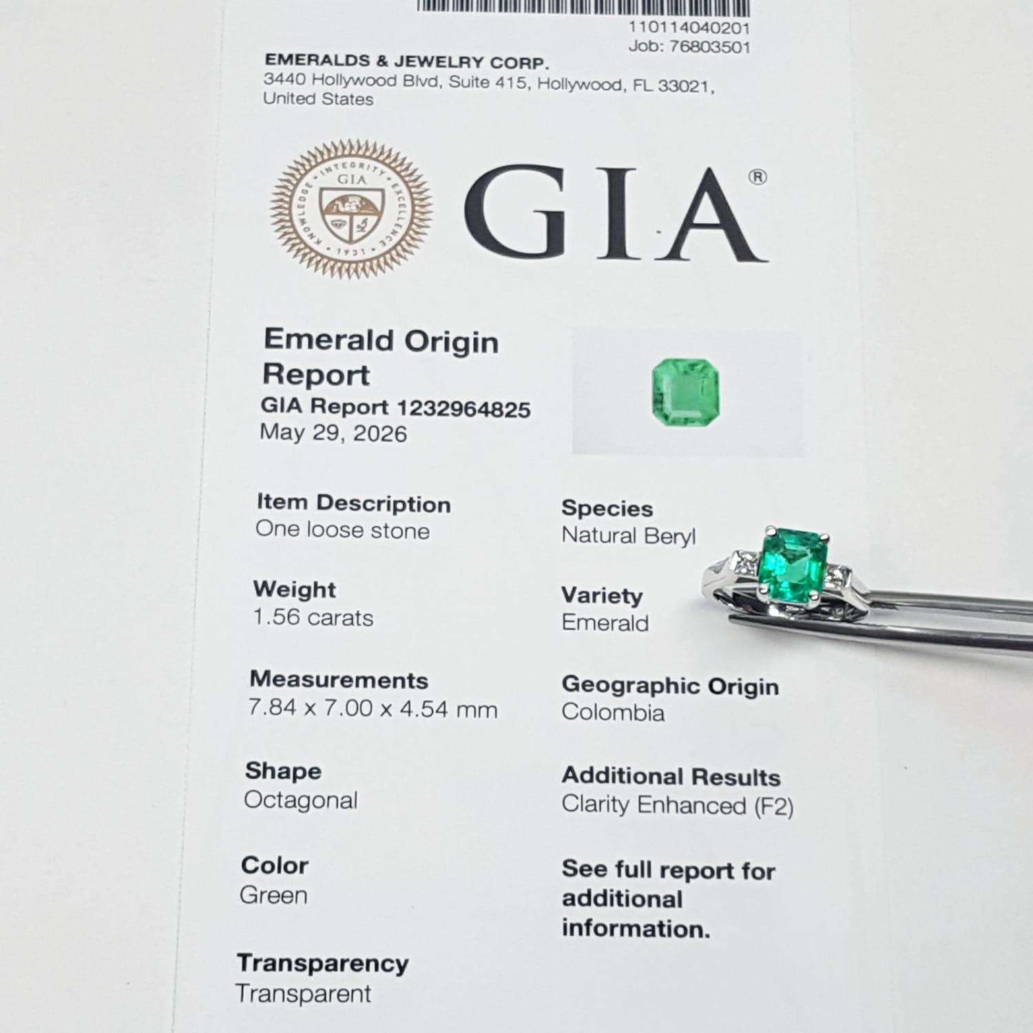 GIA emerald origin report with a loose emerald stone and its appraisal.
