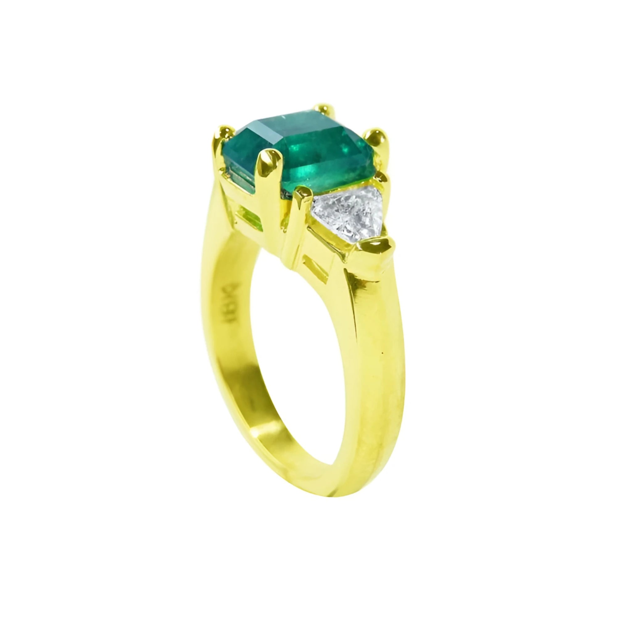 18K yellow gold ring with a GIA certified emerald and side trillion diamonds.