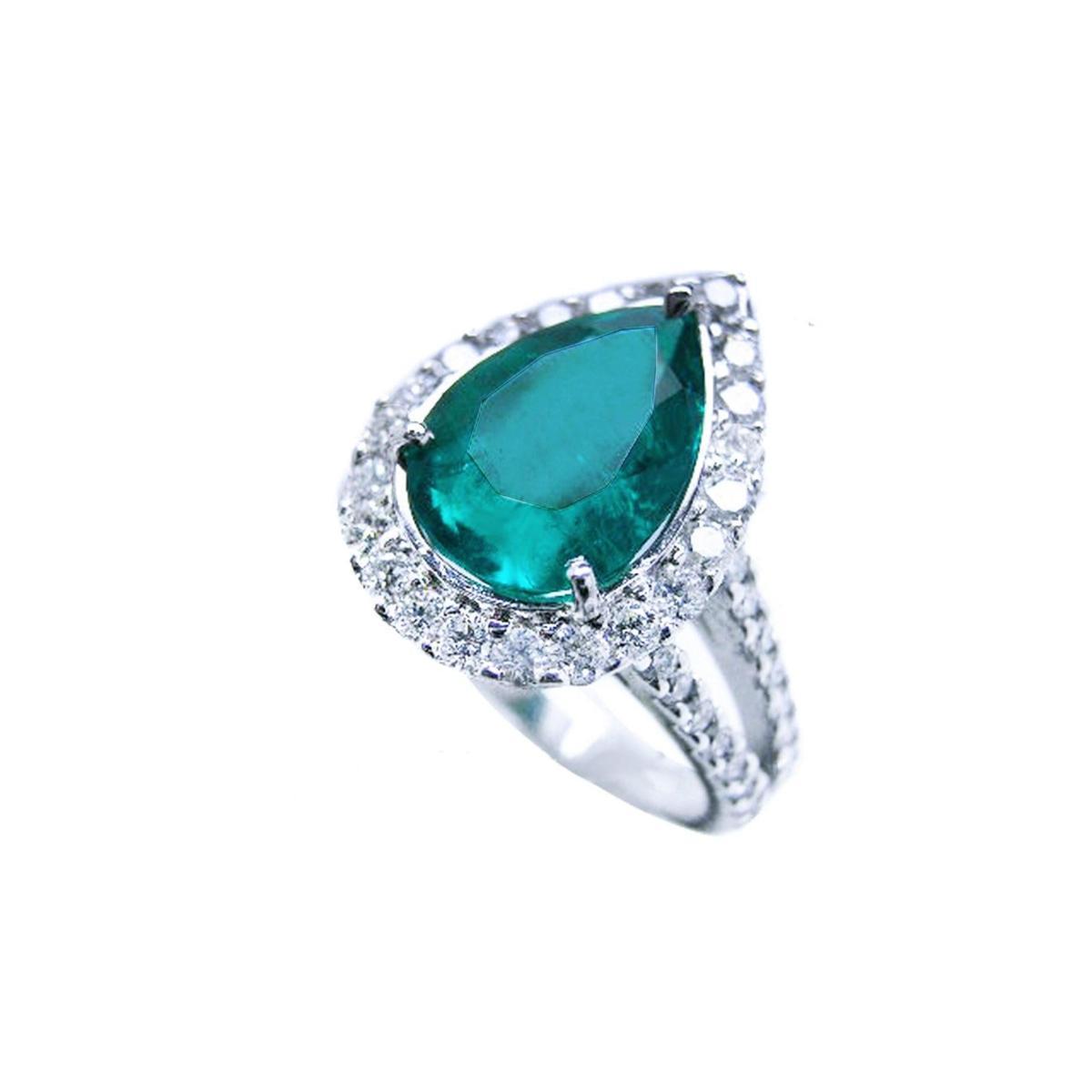Brides' emerald engagement rings pear cut with halo diamond, top and side profile view.