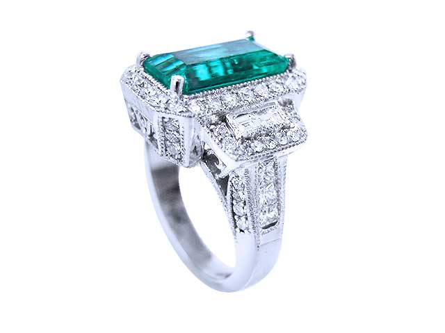 Solid white gold rings with emerald