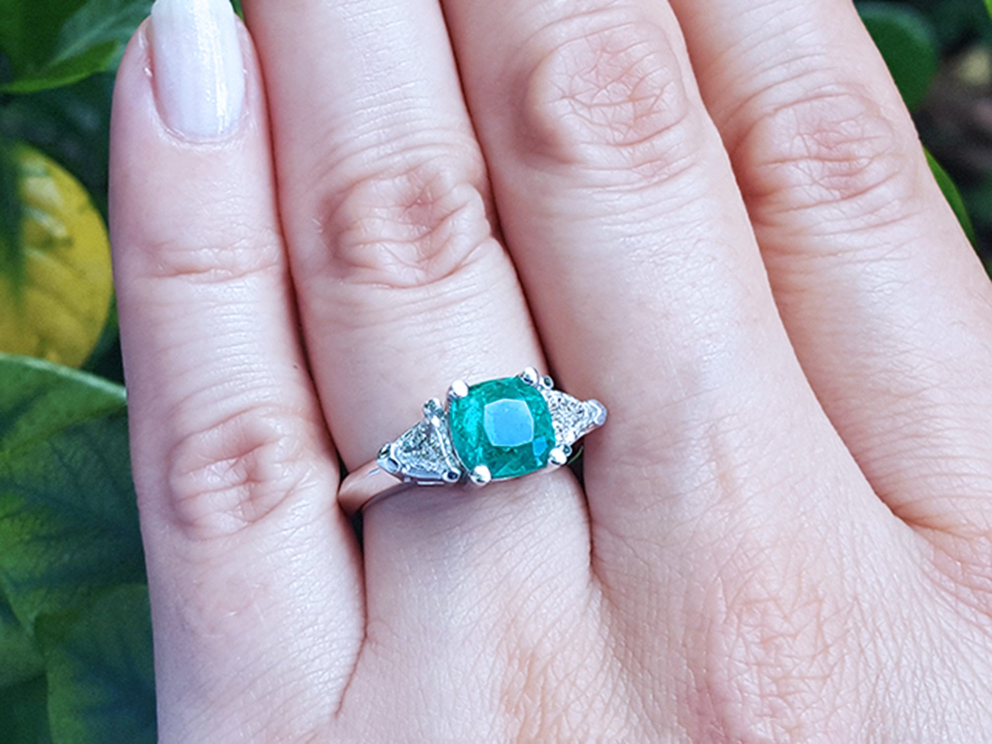 Natural emerald ring trillion side diamonds