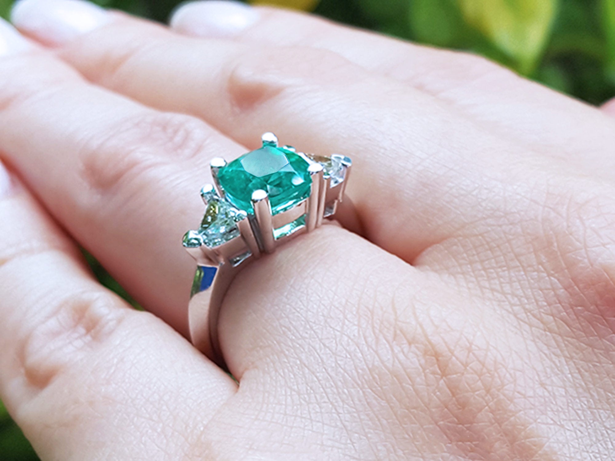 May&#39;s birthstone emerald ring cushion cut trillion side diamonds