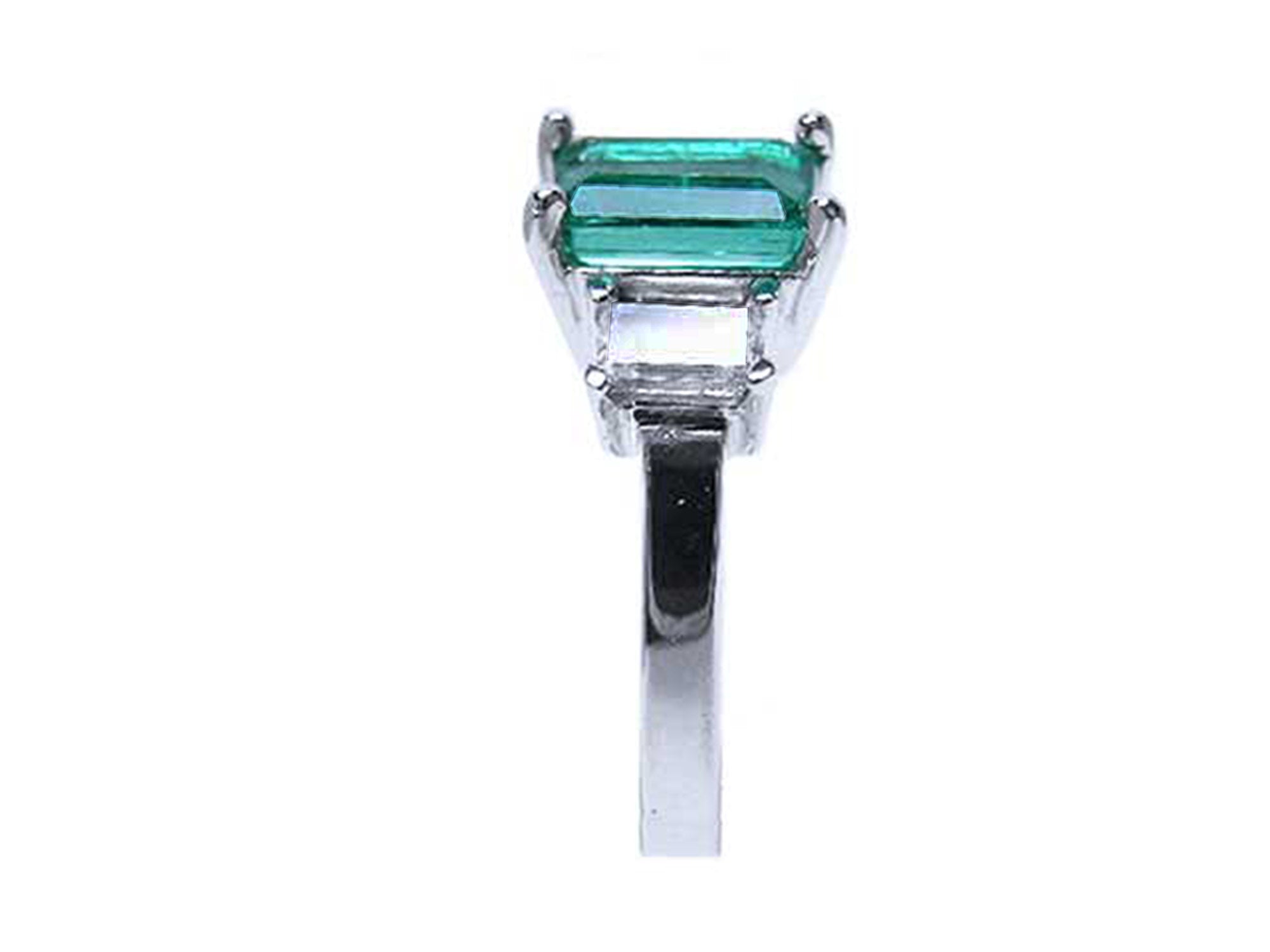 Three stone emerald engagement rings
