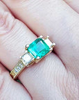 Women’s emerald and gold rings