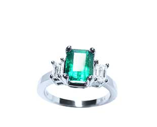 three stone emerald cut ring with diamond