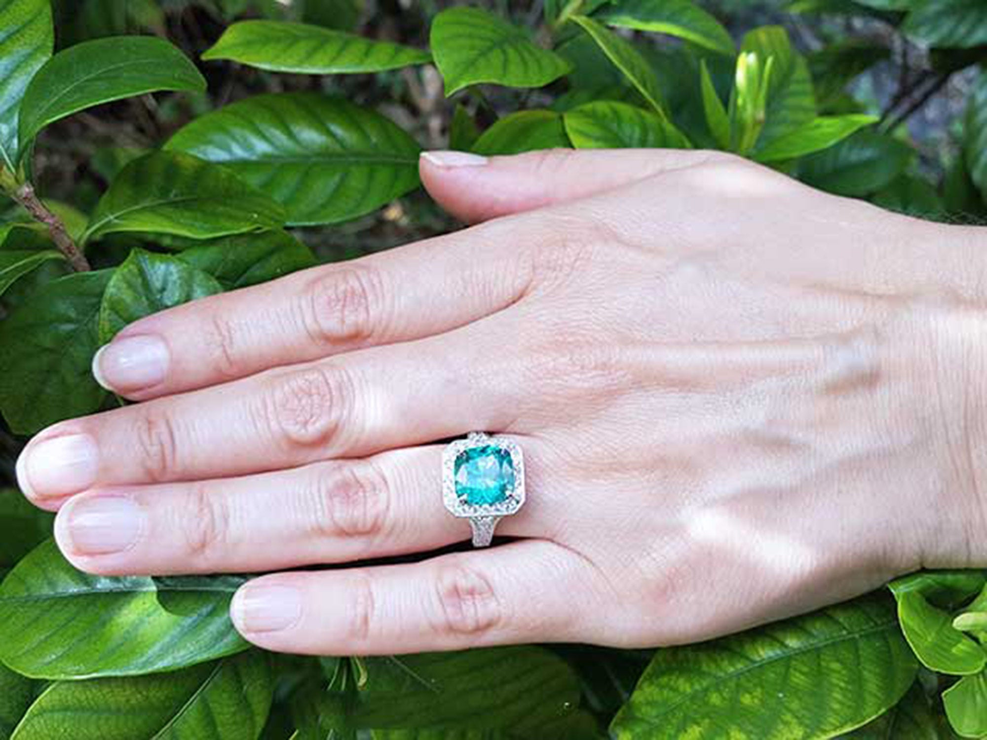 Halo emerald engagement ring