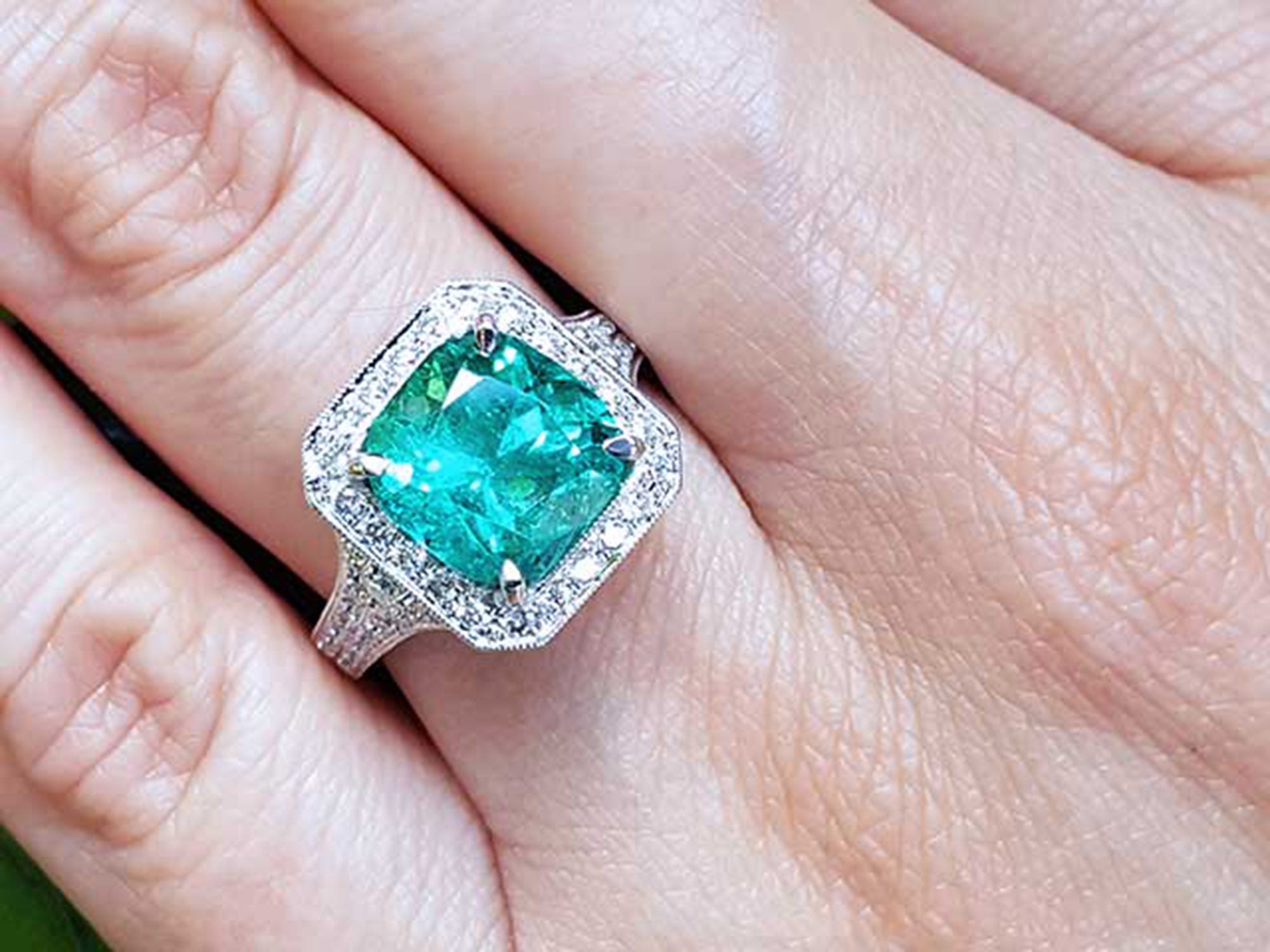 Ladies emerald ring cushion cut