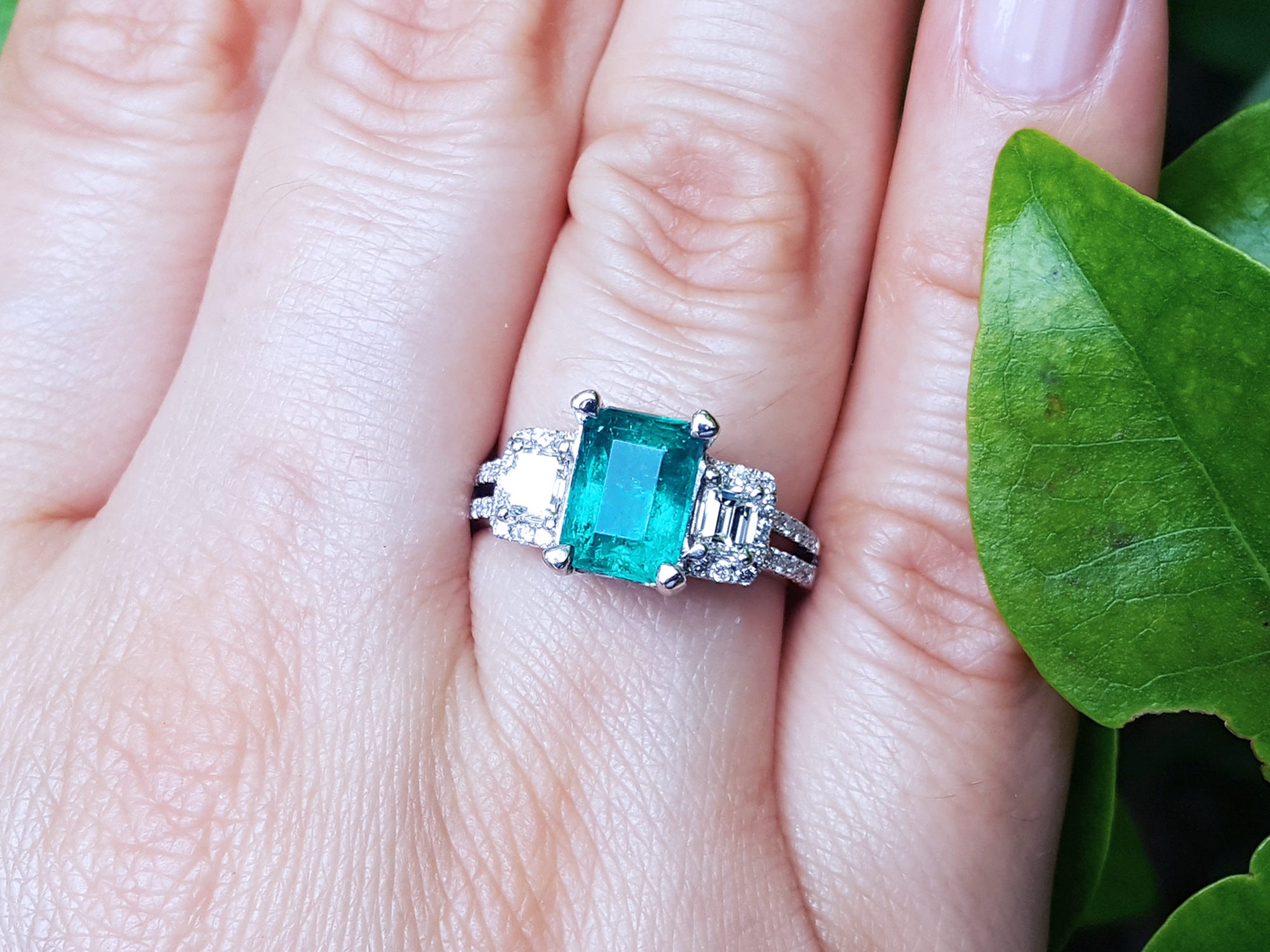 Emerald and diamond engagement ring