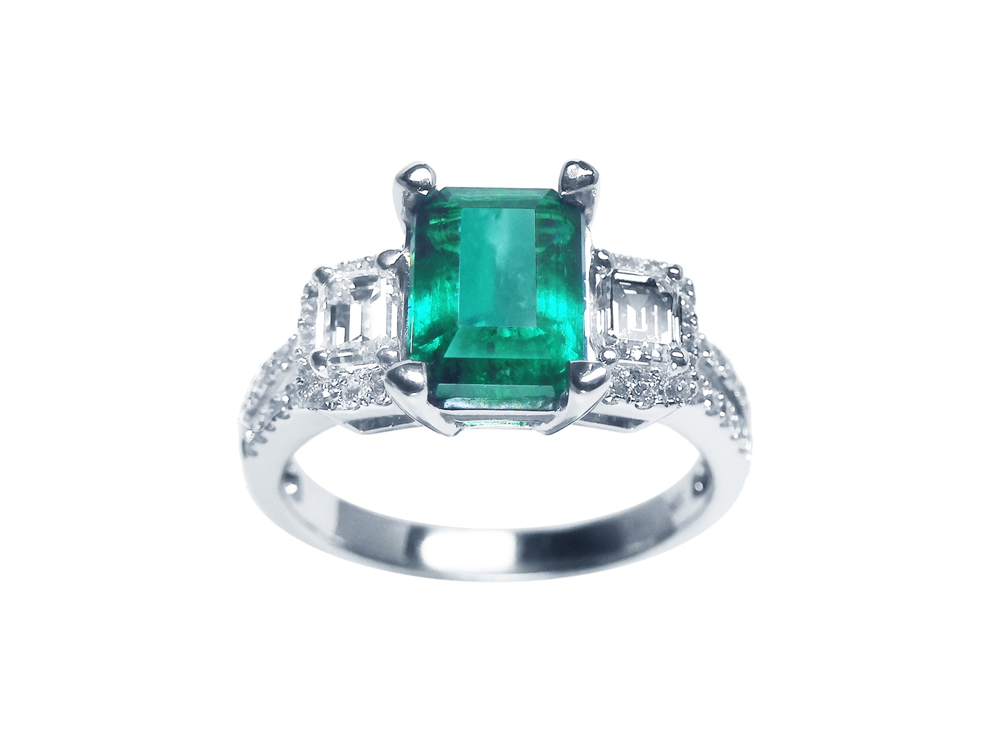 Tree stone emerald engagement ring