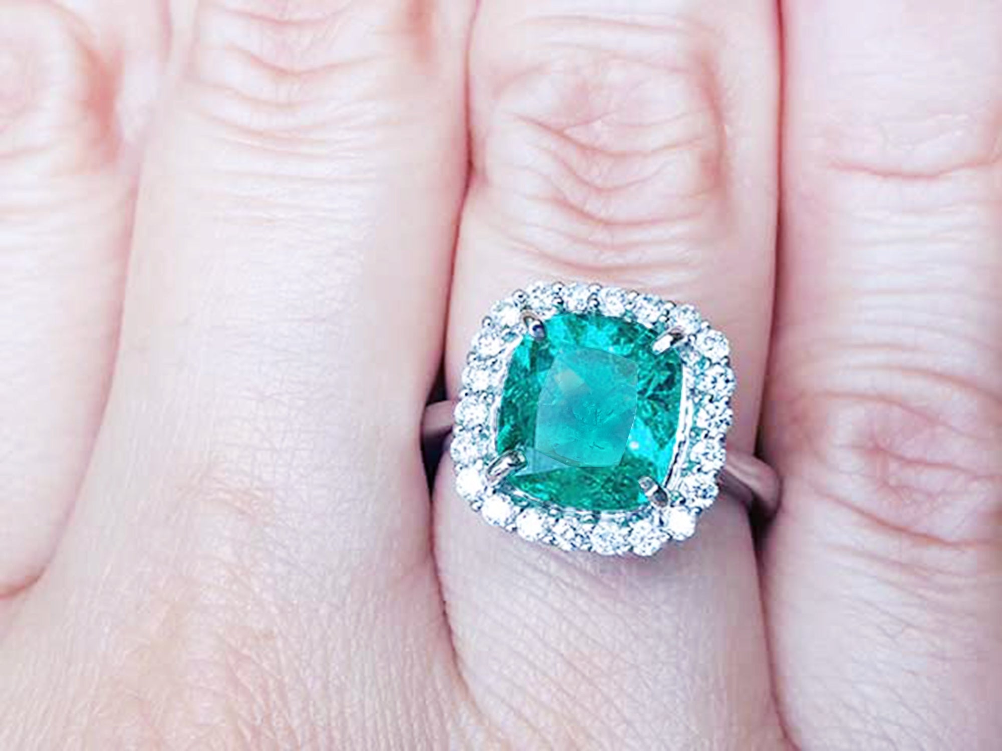 Emerald engagement ring cushion cut