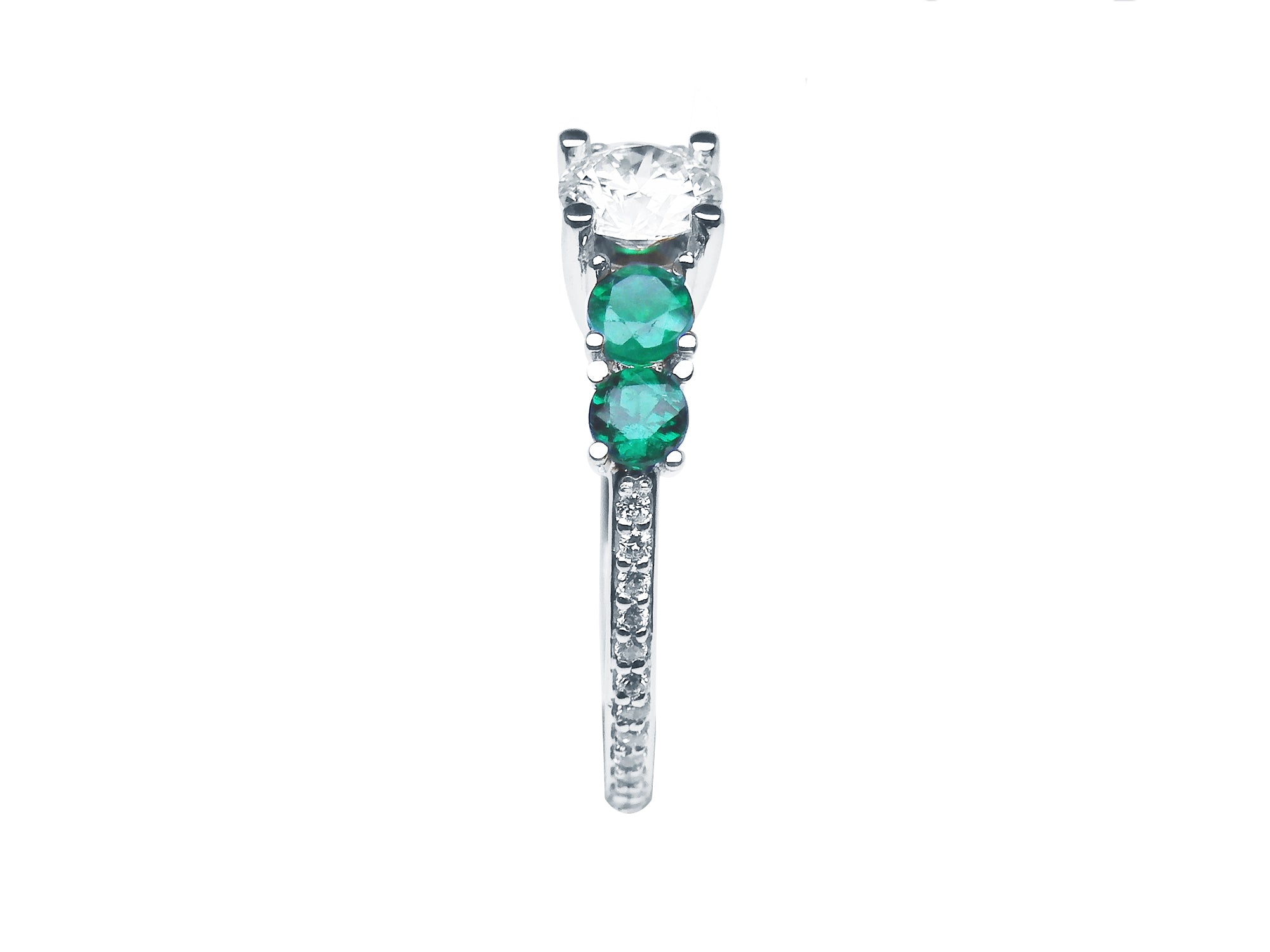 Round cut diamond and emerald engagement ring