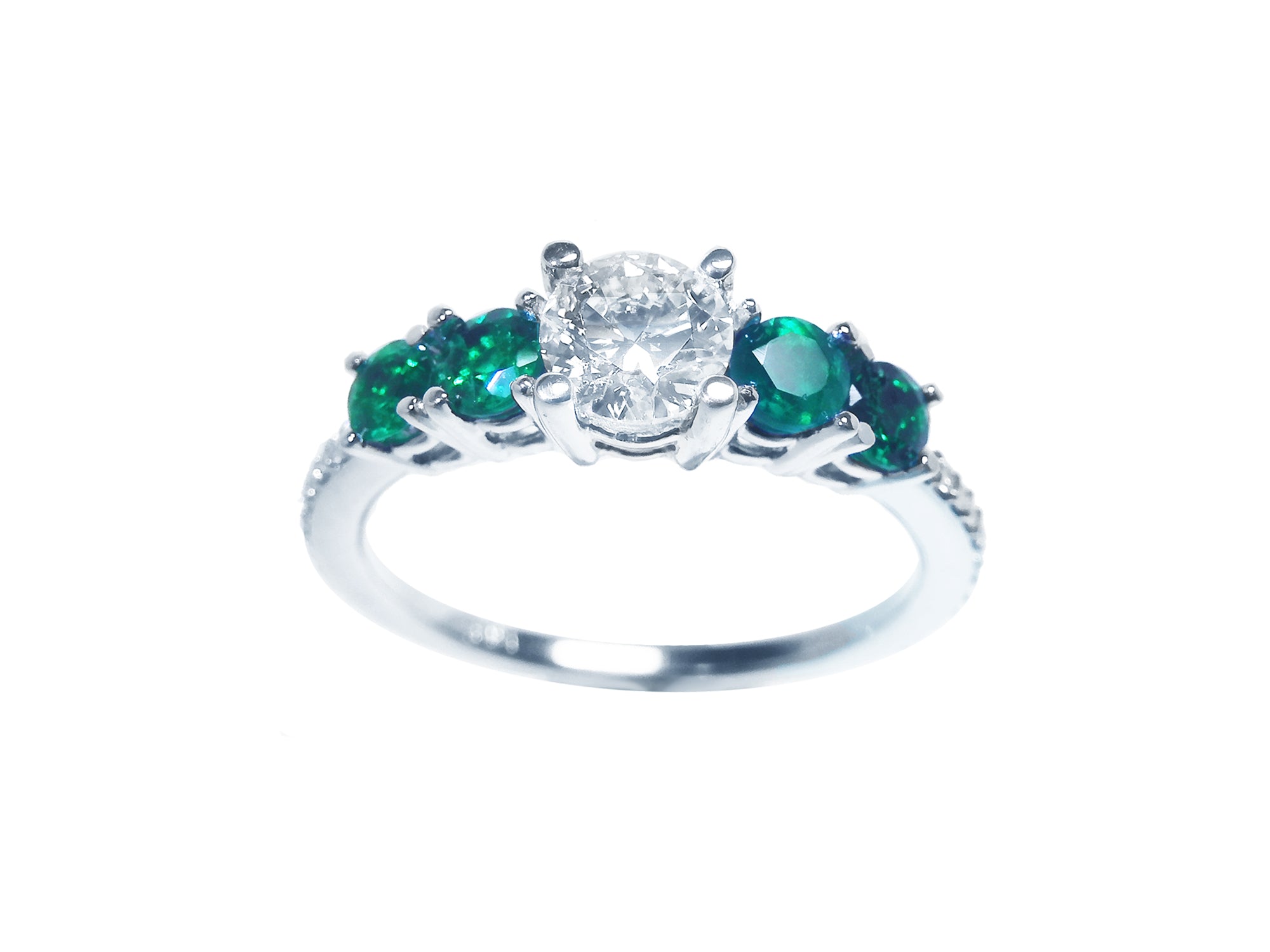 Ladies emeralds and diamond ring