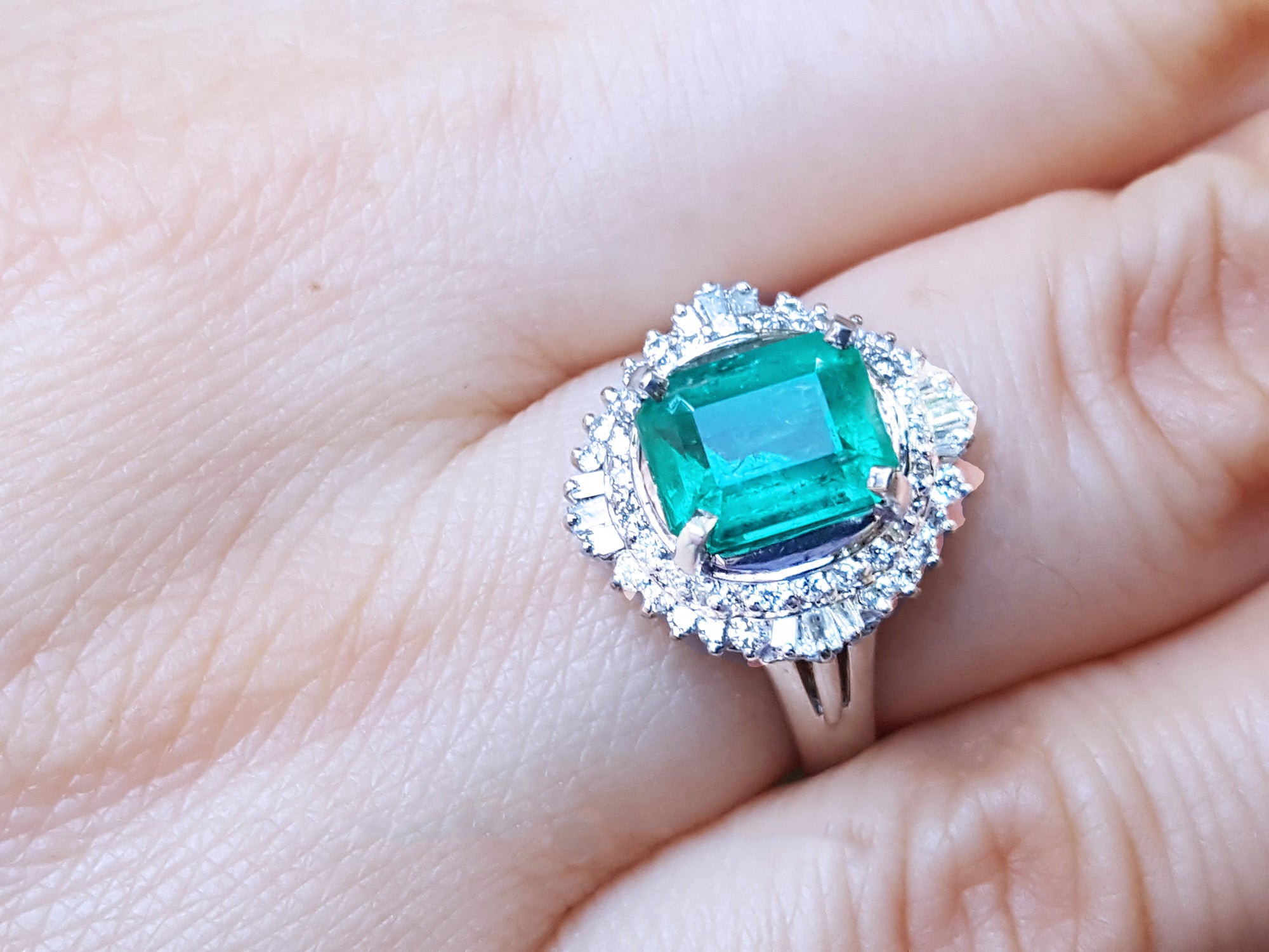 Women's platinum emerald and diamond ring