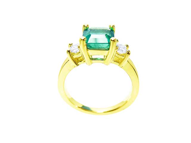 Unique emerald 18k gold engagement ring