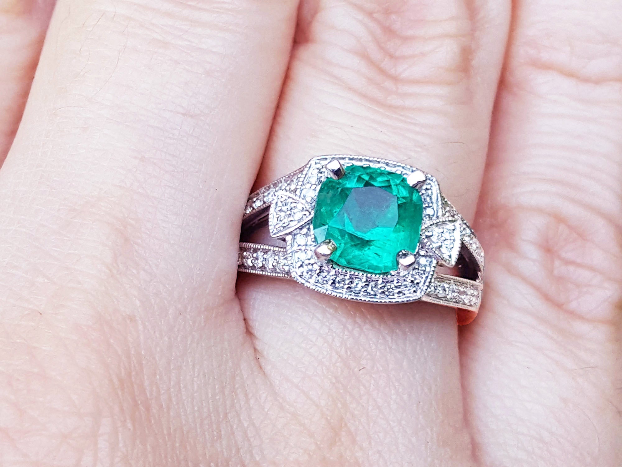 Cushion cut emerald engagement ring