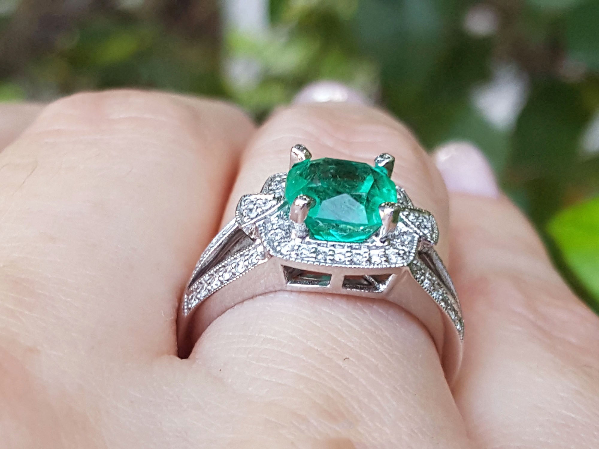 Engagement ring with emerald and diamonds