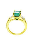 Solid yellow gold rings with emerald