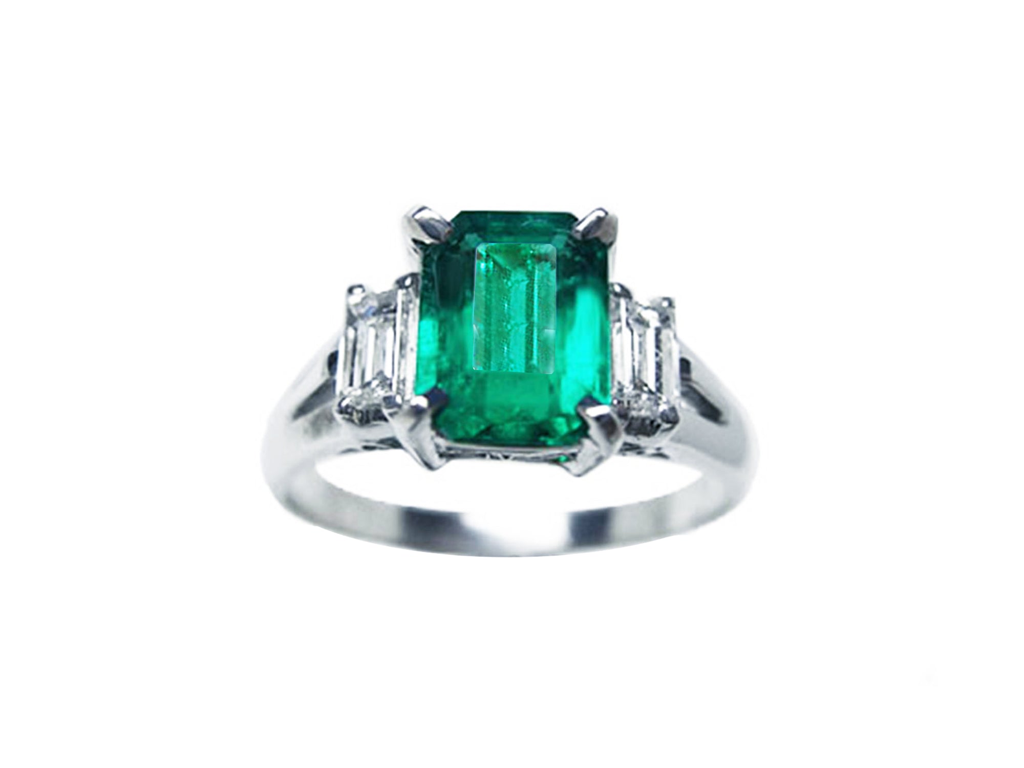 Three stone emerald platinum ring