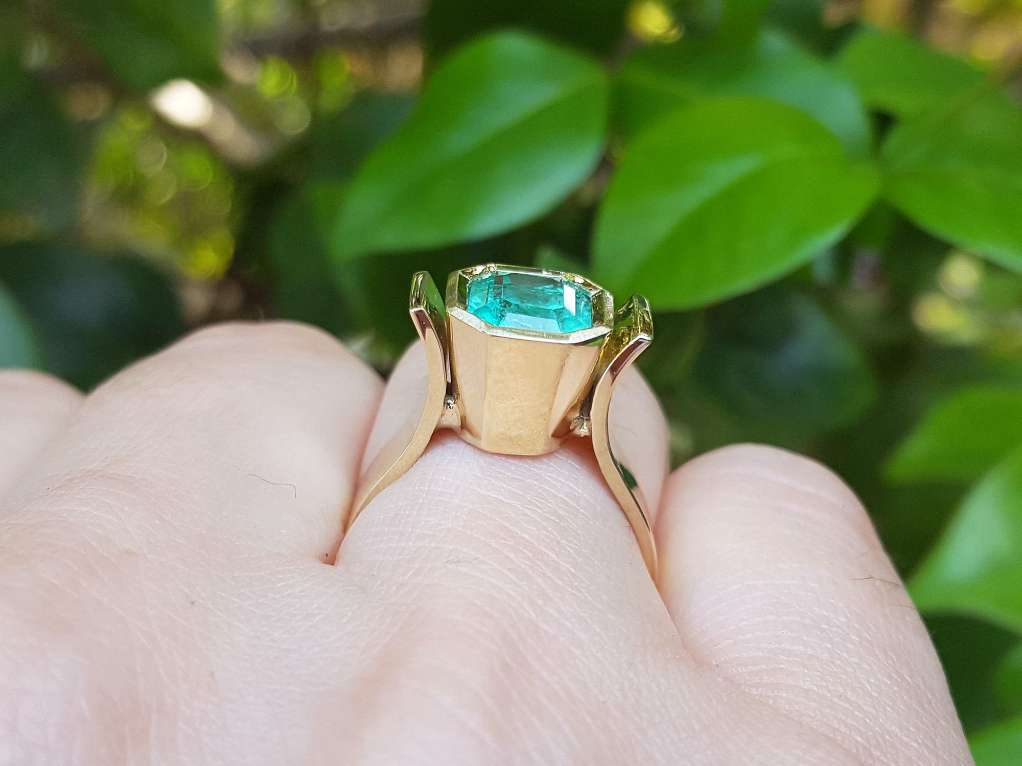 Bezel set solitaire emerald ring for women
