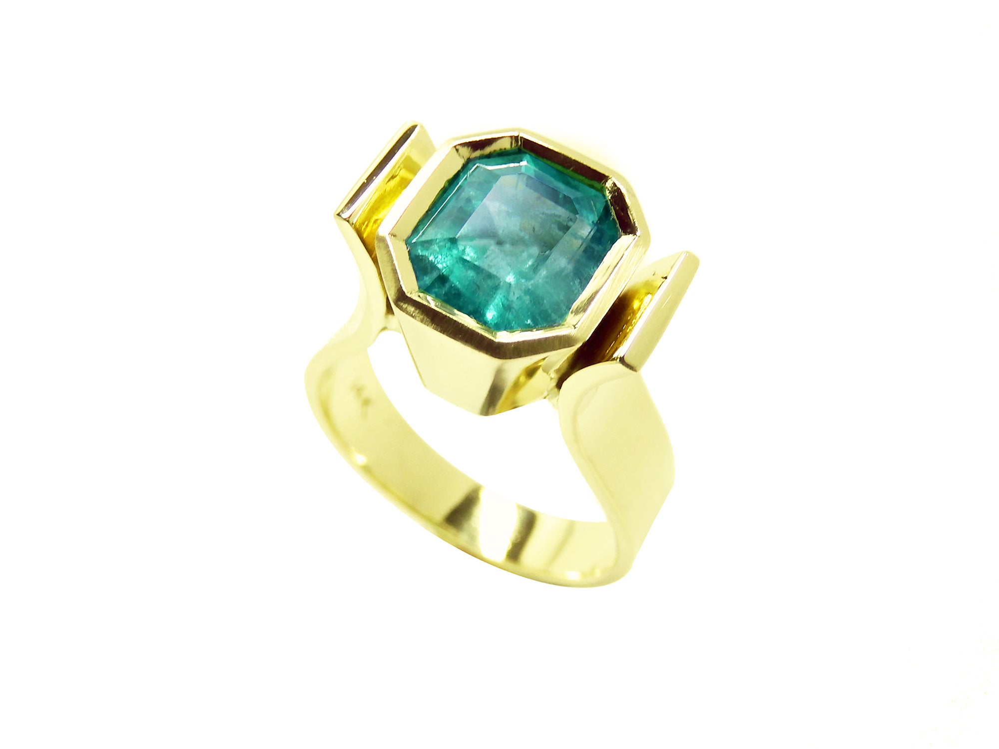 Women's emerald bezel set ring