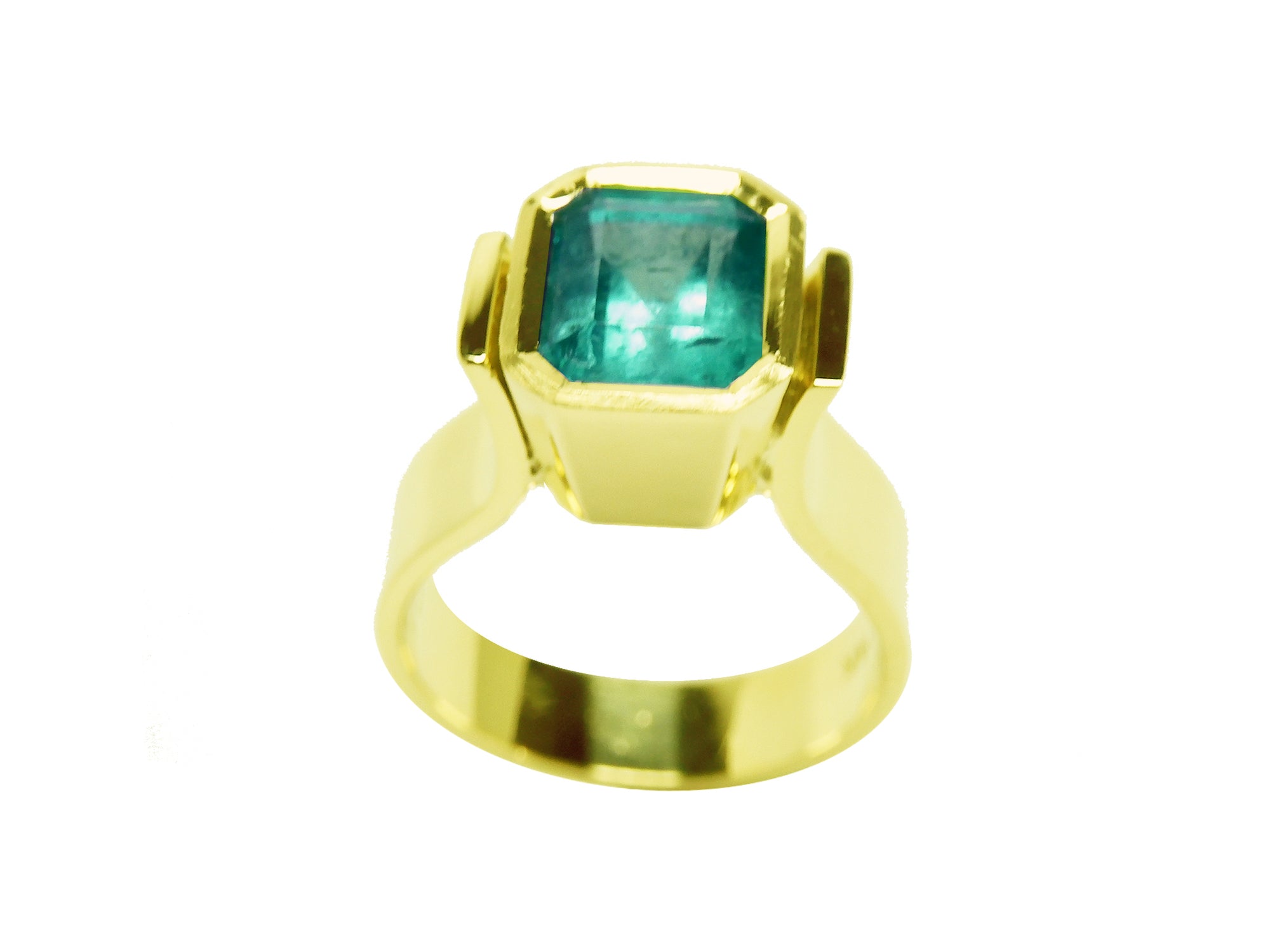 Bezel set solitaire emerald gold ring