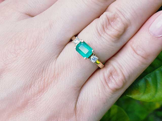 Affordable three stone emerald ring