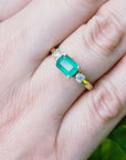 Affordable three stone emerald ring