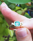 Solitaire emerald ring bezel set