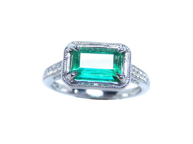 Affordable white gold emerald engagement ring