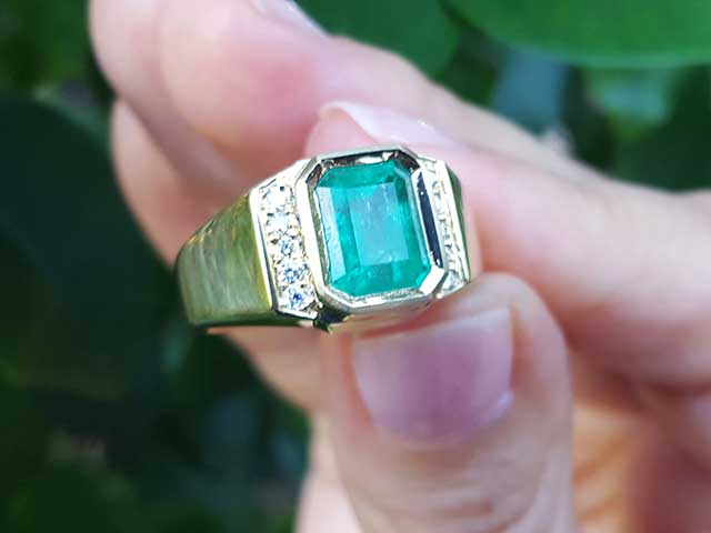 Natural emerald bezel set ring