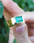 Solid gold ring with emerald