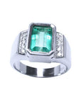 Solid white gold ring with emerald